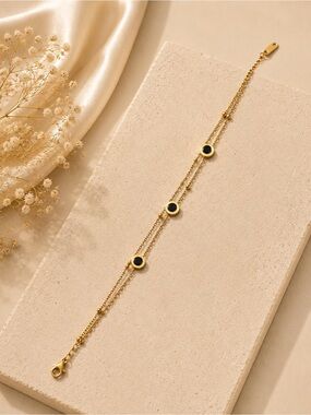 Gold Double-Chain Bracelet with Black Accent Discs